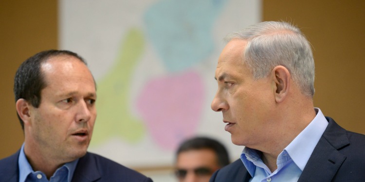 Bibi talking to a man on his right.