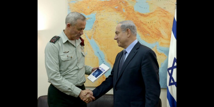 Benny Gantz and Benjamin Netanyahu shaking hands.