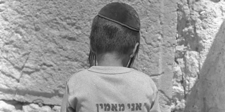 Jewish boy at Western Wall for Tisha B'Av