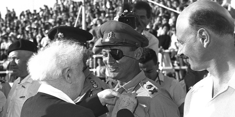 Moshe Dayan, with eye patch, being awarded by David Ben-Gurion, 1958.