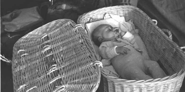 A Jewish baby gets sleep in a basket aboard the aliyah ship, 