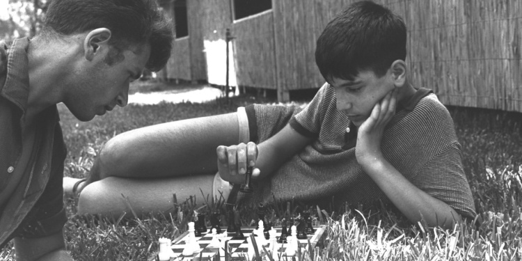 Two Israeli youth play chess at summer camp at the Weizmann Institute in Israel, 1965