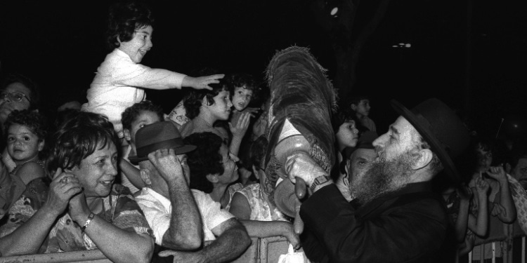 Rabbi and Jewish boy celebrate Simchat Torah, 1974, rejoicing in the beginning of the reading of God's Word