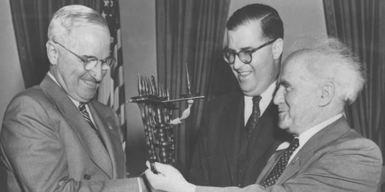 Abba Eban and David Ben-Gurion present President Harry Truman with a menorah
