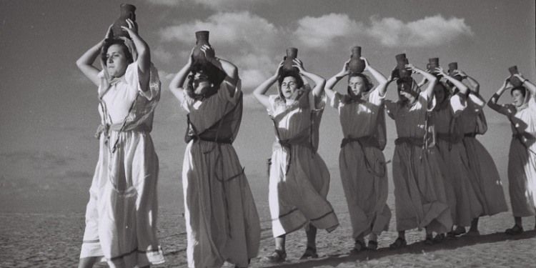 Women from kibbutz in Negev carry water from new well, 1947