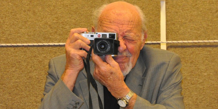 David Rubinger, an Israeli photojournalist taking a picture.
