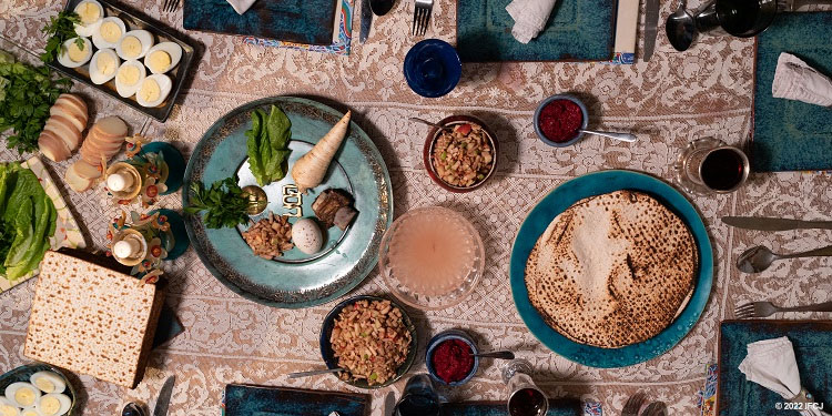 Passover model seder tabletop, seder dish, matzah, candles, plates, silverware
