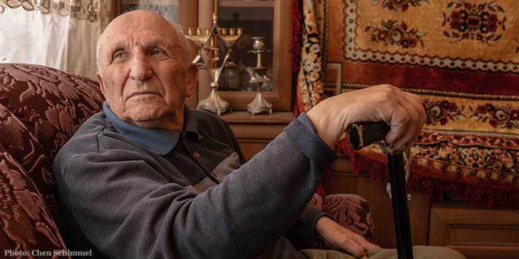 Elderly man with cane