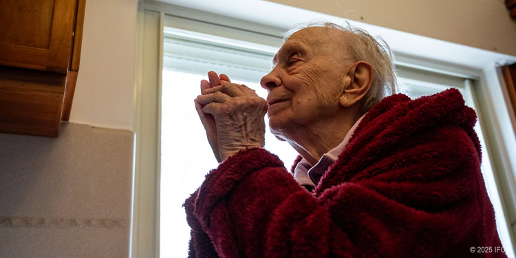 Elderly man praying