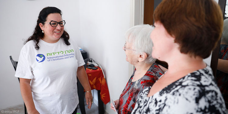 Elderly woman and two other woman chatting