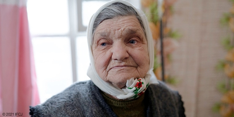 Elderly Jewish woman looking to the right of the camera.