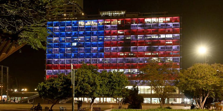Tel Aviv city hall lit with American flag