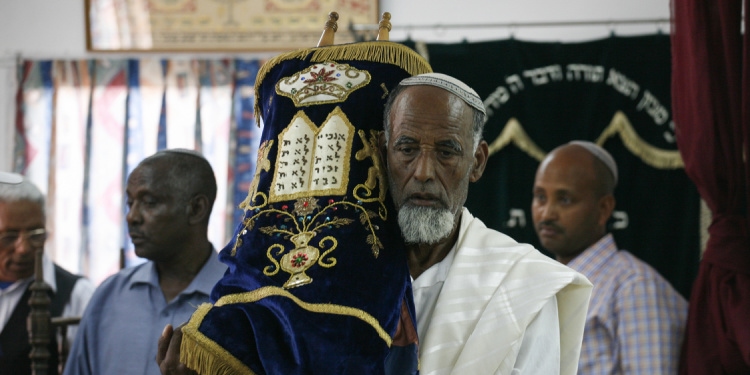 Ethiopian Jewish man with Torah scroll