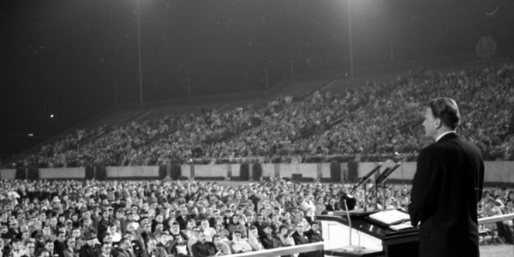 Black and white image of Billy Graham speaking.