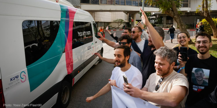 Friends of released hostage Sasha Troufanov seen as he arrives at the Sheba Medical center in Ramat Gan.