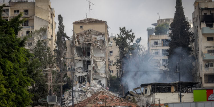 Israeli security and rescue forces at the scene where a ballistic missile fired from Iran hit and caused damage in Rehovot, June 15, 2025