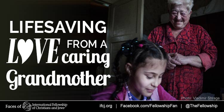 Grandmother and young girl, Katya and Rozalia smiling together as featured in an IFCJ promotion with the text reading: Lifesaving love from a caring grandmother.