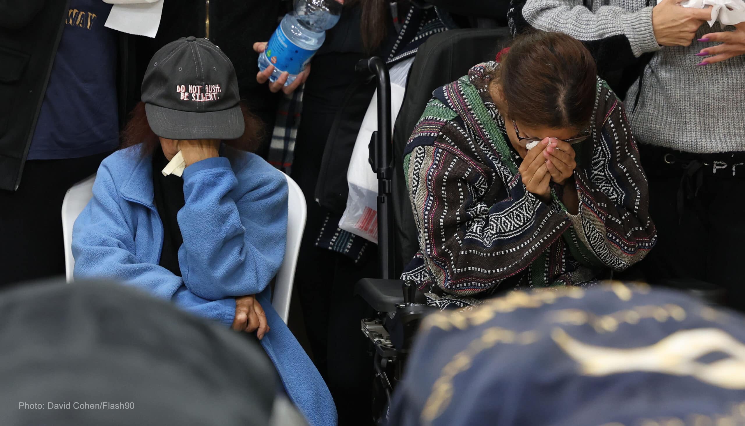 Family and friends attend a funeral of the victim in the October 7th attack