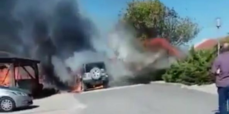 A fire happening in the middle of an Israeli road.