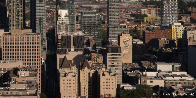 View of the skyline of the city of Montreal, with a building mural depicting Jewish Canadian Singer-songwriter Leonard Cohen, as seen from Mount Royal Park, in Quebec, Canada, on June 2, 2018. Photo by Hadas Parush/Flash90 *** Local Caption *** מונט רויאל הר תצפית עיר מונטריאול קוויבק קנדה גרפיטי ליאונרד כהן