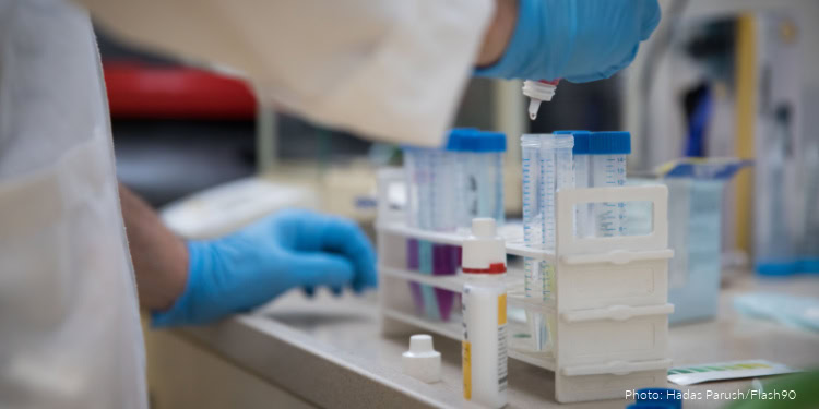 A researcher takes samples for testing at the VIAQUA Therapeutics lab at the Technion, Israel Institute of Technology, in the northern Israeli city of Haifa, on February 19, 2019. VIAQUA researches viral diseases in aqua culture