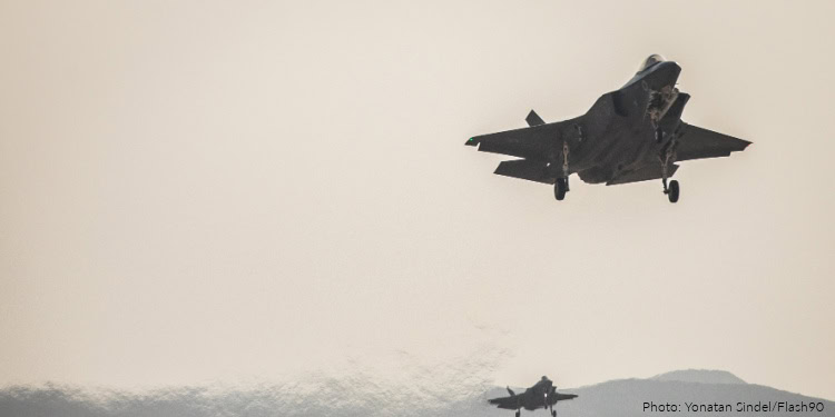 Military aircraft flying in the sky, symbolizing global aid and support efforts by IFCJ to assist vulnerable communities around the world.