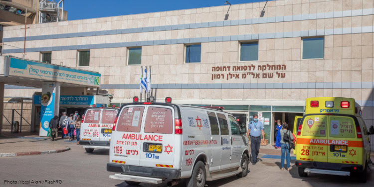 Kaplan medical staff members work at the Coronavirus ward of the Kaplan Medical Center, in Rehovot, on December 11, 2020.