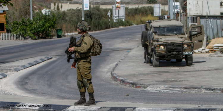 Israeli soldiers near the scene of a shooting, near the West Bank settlement of Shavei Shomron, on October 11, 2022.