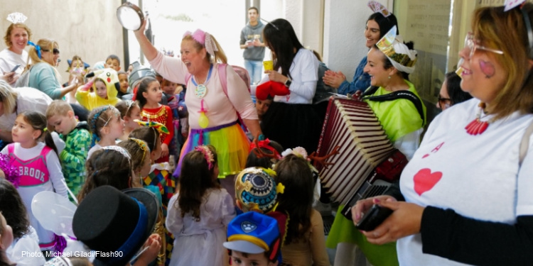 Jewish children celebrate Purim at school in the Holy Land.