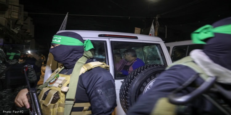 Members of the Hamas and the Islamic Jihad release Israeli hostages to the Red Cross, in Rafah, in the southern Gaza Strip, November 28, 2023.