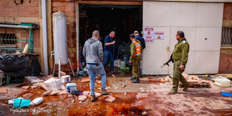 Israeli security forces look at the damage after a rocket fired from Lebanon hit the northern town of Kiryat Shmona, March 27, 2024.