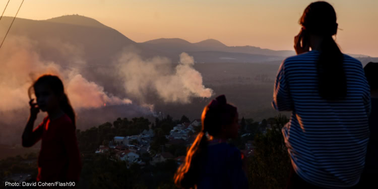 Smoke rises from a fire which broke out from missiles fired from Lebanon at a forest outside the northern Israeli city of Tzfat.