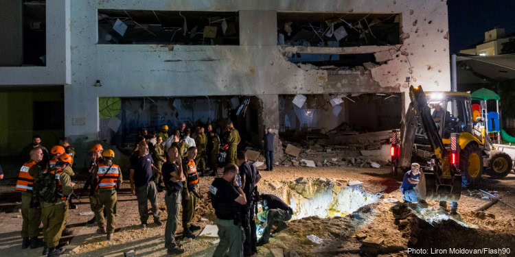 Israeli security forces at the scene where a missile fired from Iran hit a school in the town of Gedera, October 1, 2024.