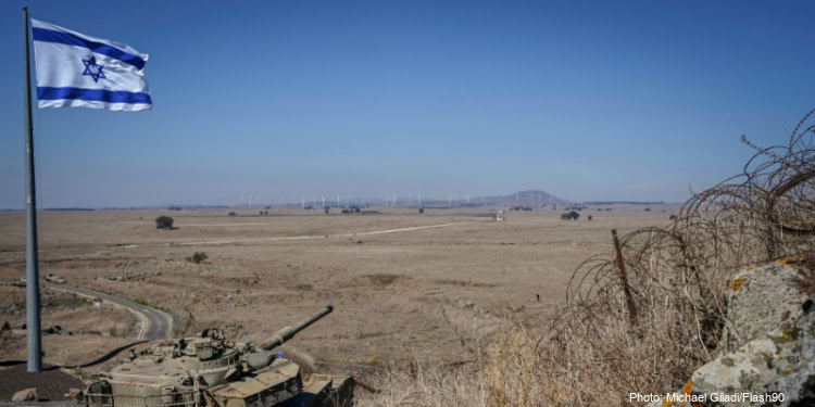 A huge 35 square meters Israeli national flag is raised on the eve of Yom Kippur to remember the fallen soldiers of the 1973 Kippur War in the Golan Heights, Tel Saki Memorial Site, Golan Heights, October 11, 2024.