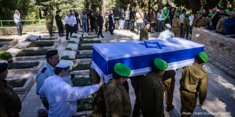 Family and friends of Israeli soldier Major (res.) Aviram Hariv, attend his funeral at Mount Herzl Military Cemetery in Jerusalem on October 23, 2024. He fell in battle in southern Lebanon