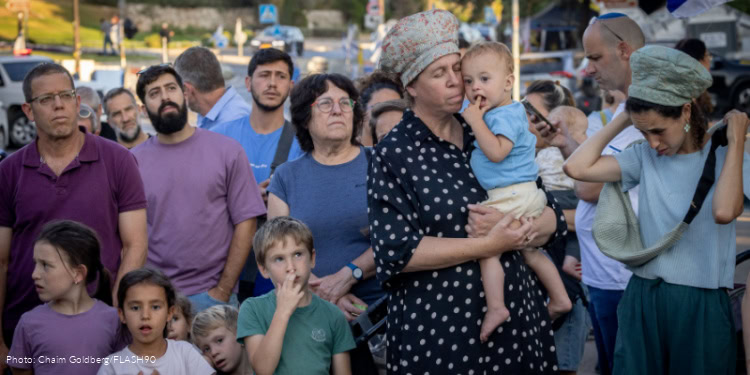 Families of reservists and activists in favor of recruiting ultra-Orthodox, demonstrate outside PM's office in Jerusalem June 12, 2025.