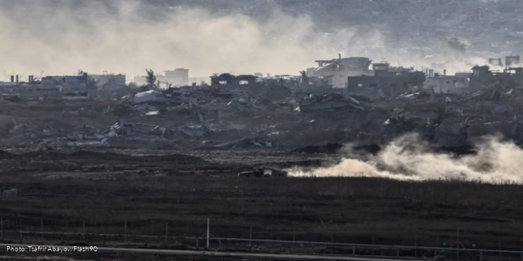 Israeli soldiers seen inside the Gaza Strip, as it seen from the Israeli side of the border, July 17, 2025.