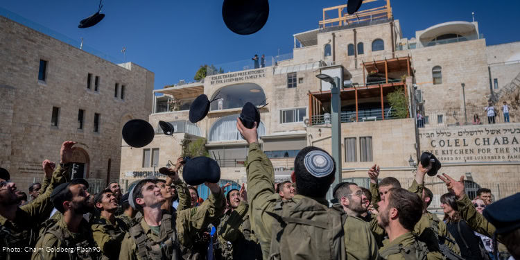 Ultra orthodox Jewish soldiers from the Hasmonean Brigade take part in a beret march after completing seven months of basic and advanced training, at the Western Wall in Jerusalem's Old city on August 6, 2025.