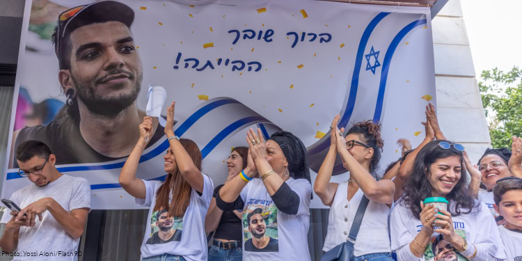 Family and friends of Israeli hostage Yosef Chaim Ohana watch his release from Hamas captivity in Ramla, October 13, 2025.