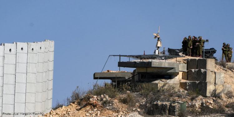 IDF soldiers near the Lebanese border look towards southern Lebanon, November 19, 2025