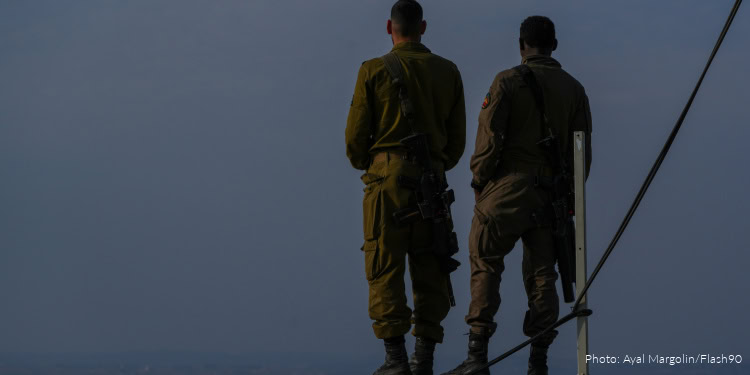 Israeli soldiers stand near the border with Lebanon in northern Israel, December 4, 2025.