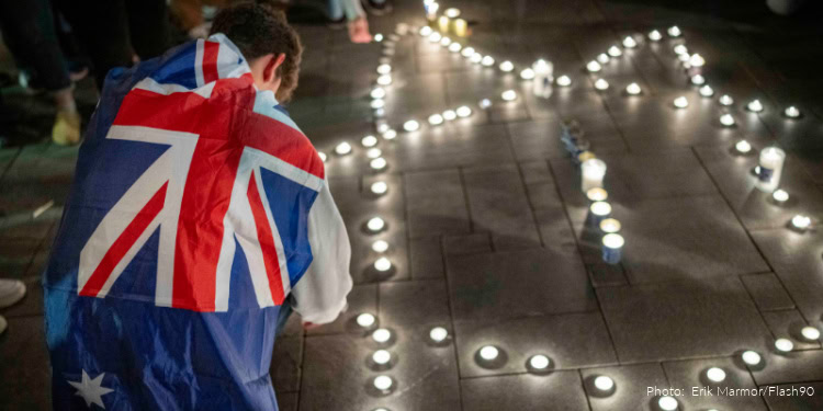People light candles in memory of the victims of the mass shooting attack in Sydney targeting the Jewish community during Hanukkah celebrations, in Tel Aviv, on December 14, 2025.