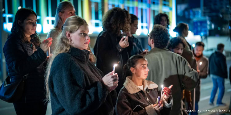 People light candles in memory of the victims of the mass shooting attack in Sydney targeting the Jewish community during Hanukkah celebrations, in Tel Aviv, on December 14, 2025.