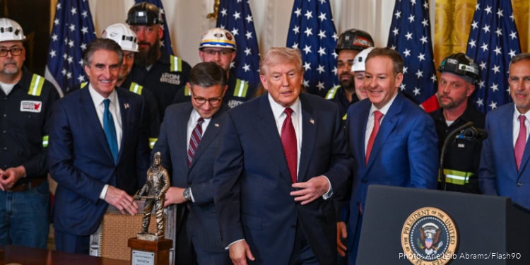 Emergency responders and officials with President Donald Trump at a formal event supporting IFCJ's humanitarian efforts.
