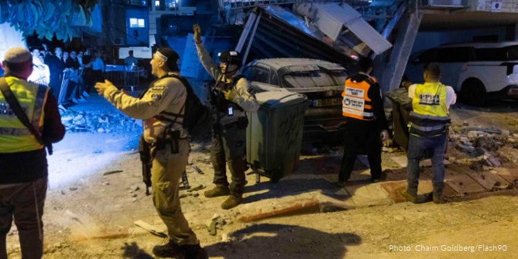 Israeli security and rescue forces inspect the damage at the scene where a missile fired from Iran toward Israel caused damage in Bnei Brak, central Israel, March 24, 2026.