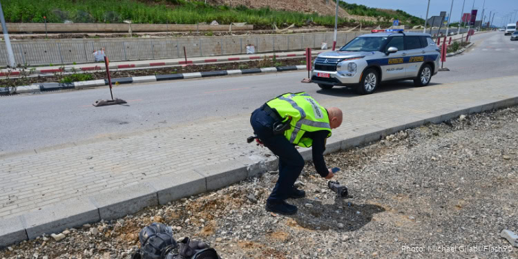 Police inspect a fallen interceptor engine following a missile attack on northern Israel, March 26, 2026.