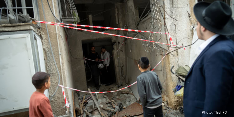 Scene of injured individuals and emergency responders after an incident on Passover Eve in Central Israel, highlighting the need for aid and community support.