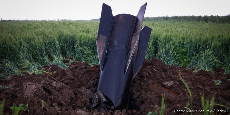 A fragment of a missile fired from Iran toward Israel, intercepted by Israeli air defense systems, seen lodged in the ground in the Golan Heights, April 7, 2026.