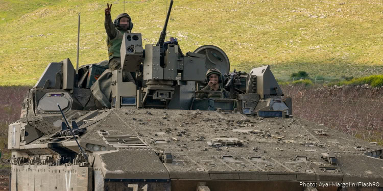 Israeli military vehicles are seen along the Israeli border with Lebanon amid the ongoing war, April 8, 2026.