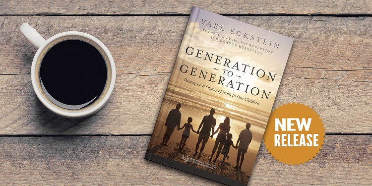 Yael Eckstein's Generation to Generation book on a table next to a cup of coffee.